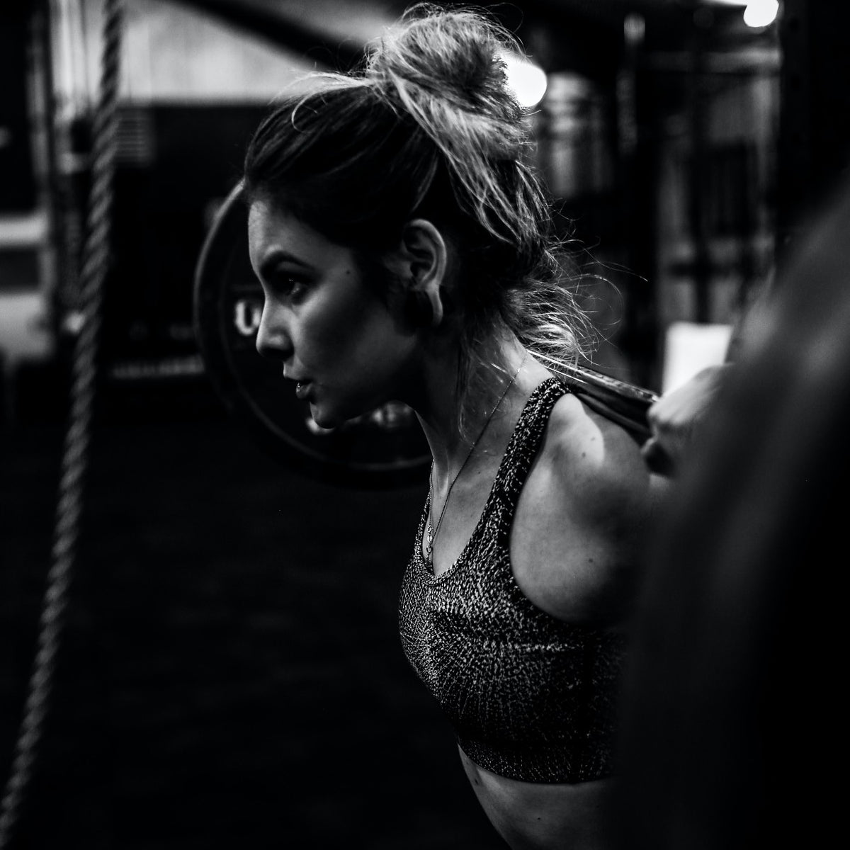 woman lifting weights do more crossfit gym gear